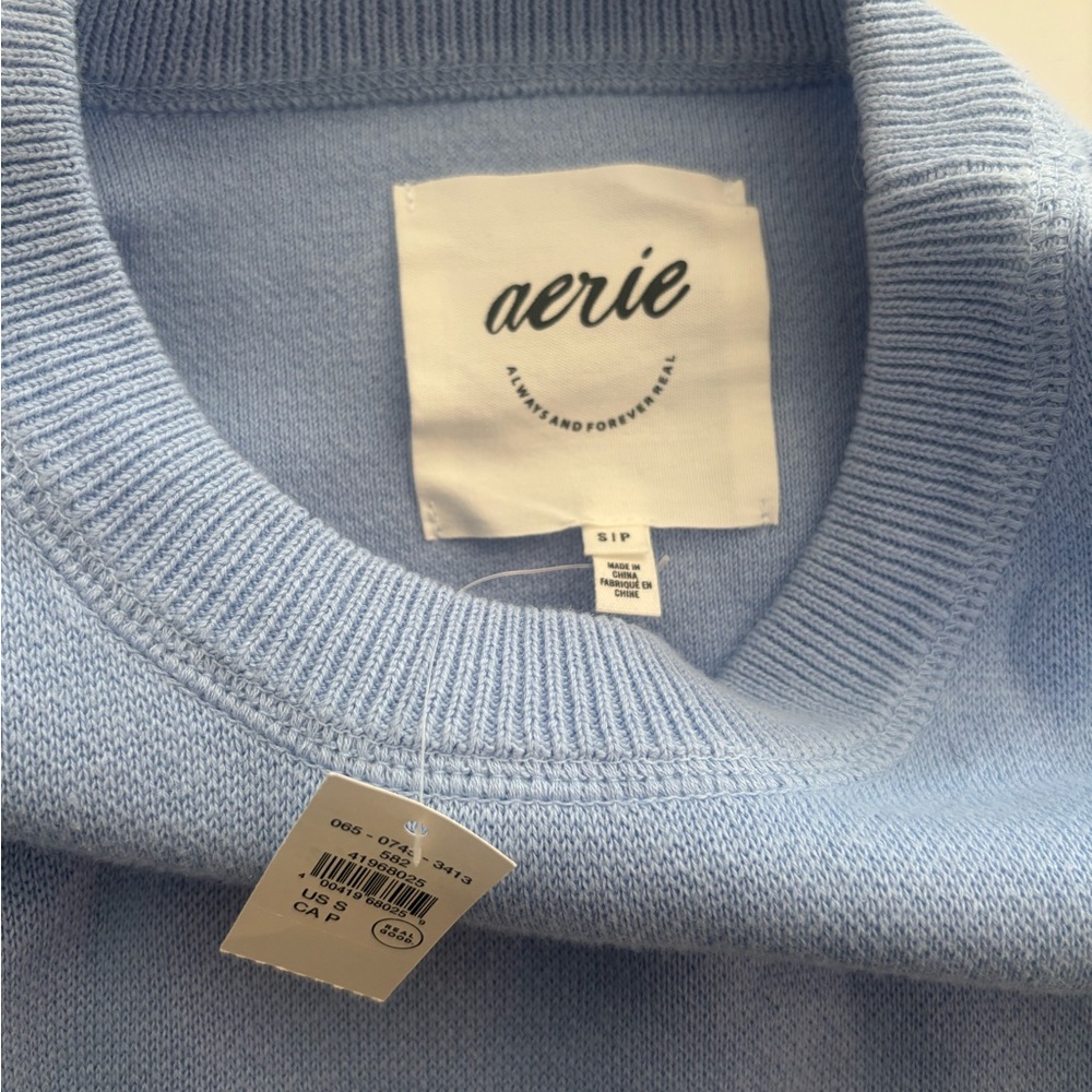 blue crewneck. with tags